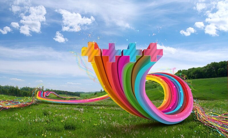 Colorful abstract sculpture in field