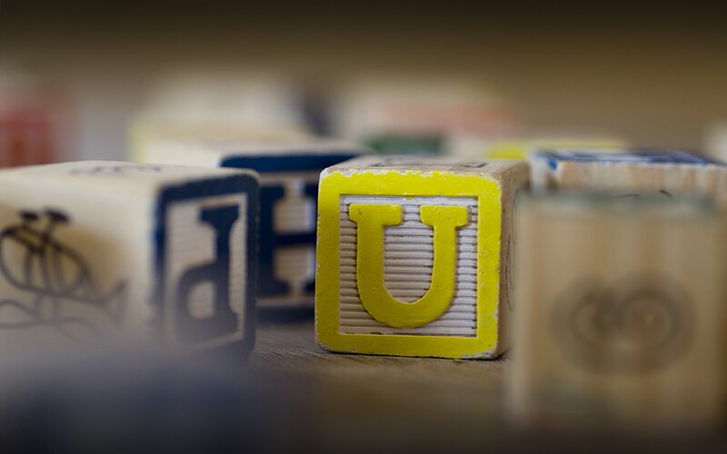 Colorful alphabet blocks on a shelf