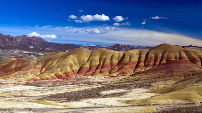 Colorful badlands under blue sky