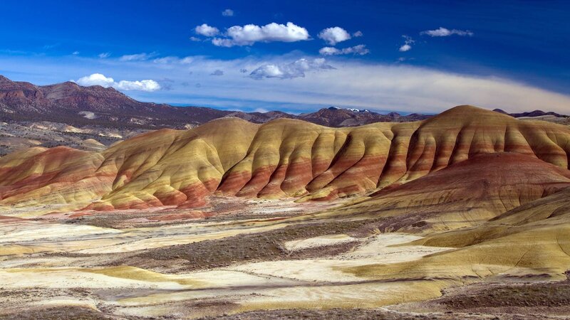 Colorful badlands under blue sky