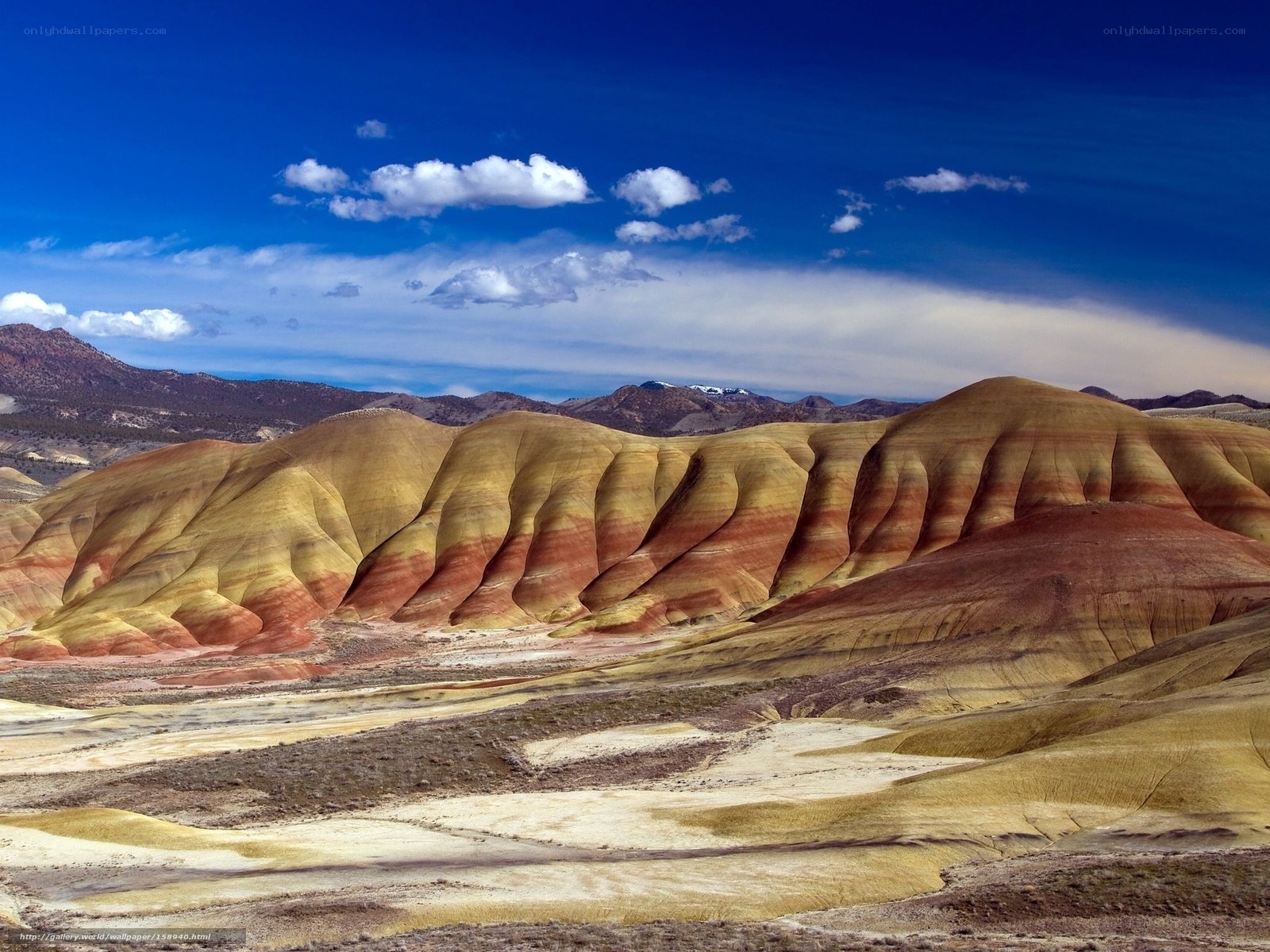 Colorful badlands under blue sky