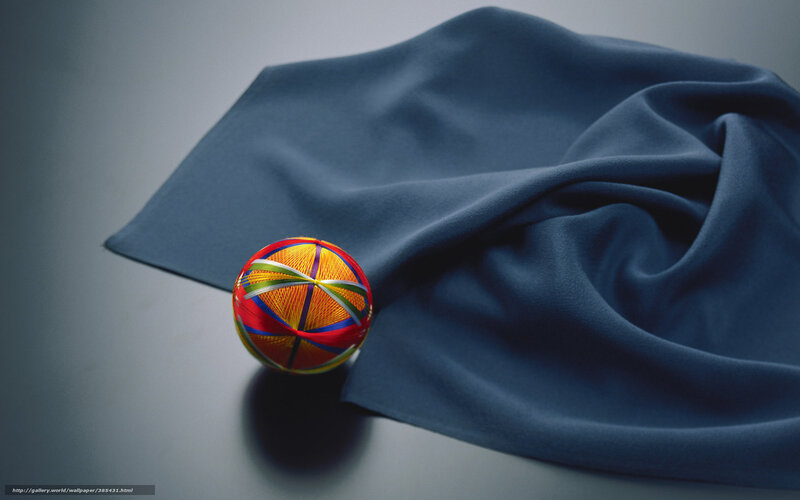 Colorful ball on blue fabric