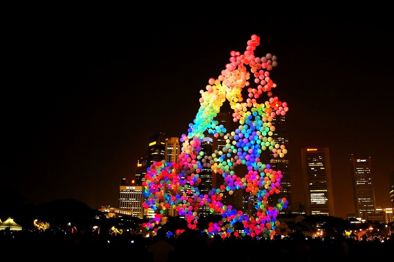 Colorful balloon sculpture at night