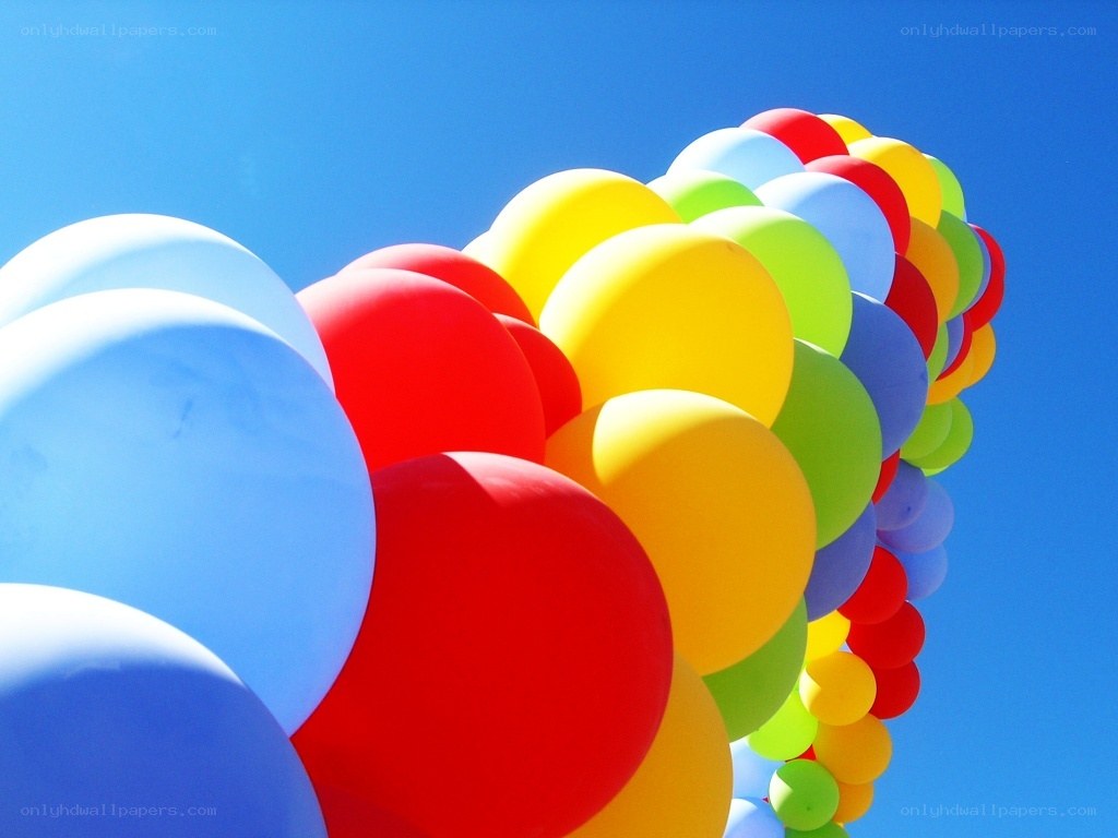 Colorful balloons against blue sky