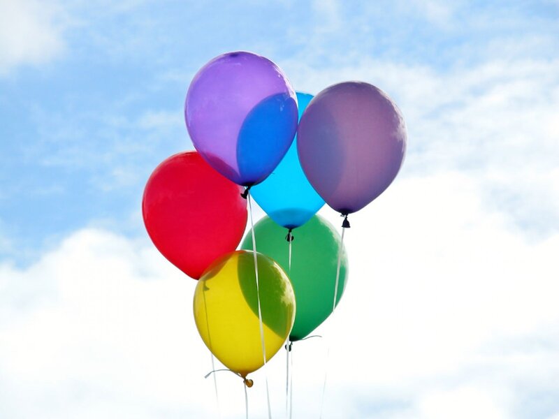 Colorful balloons against blue sky