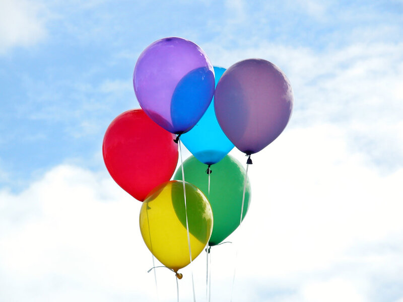 Colorful balloons against blue sky