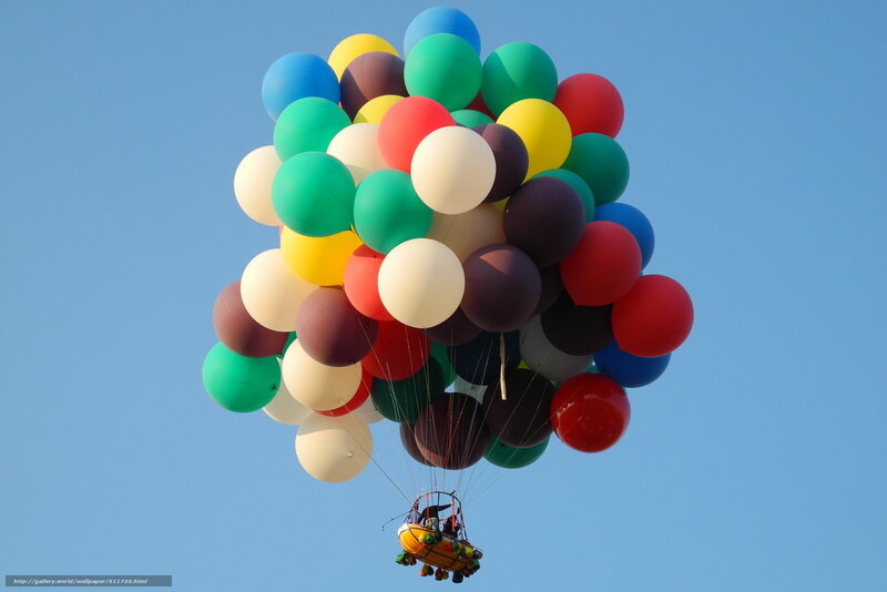 Colorful balloons lifting a basket