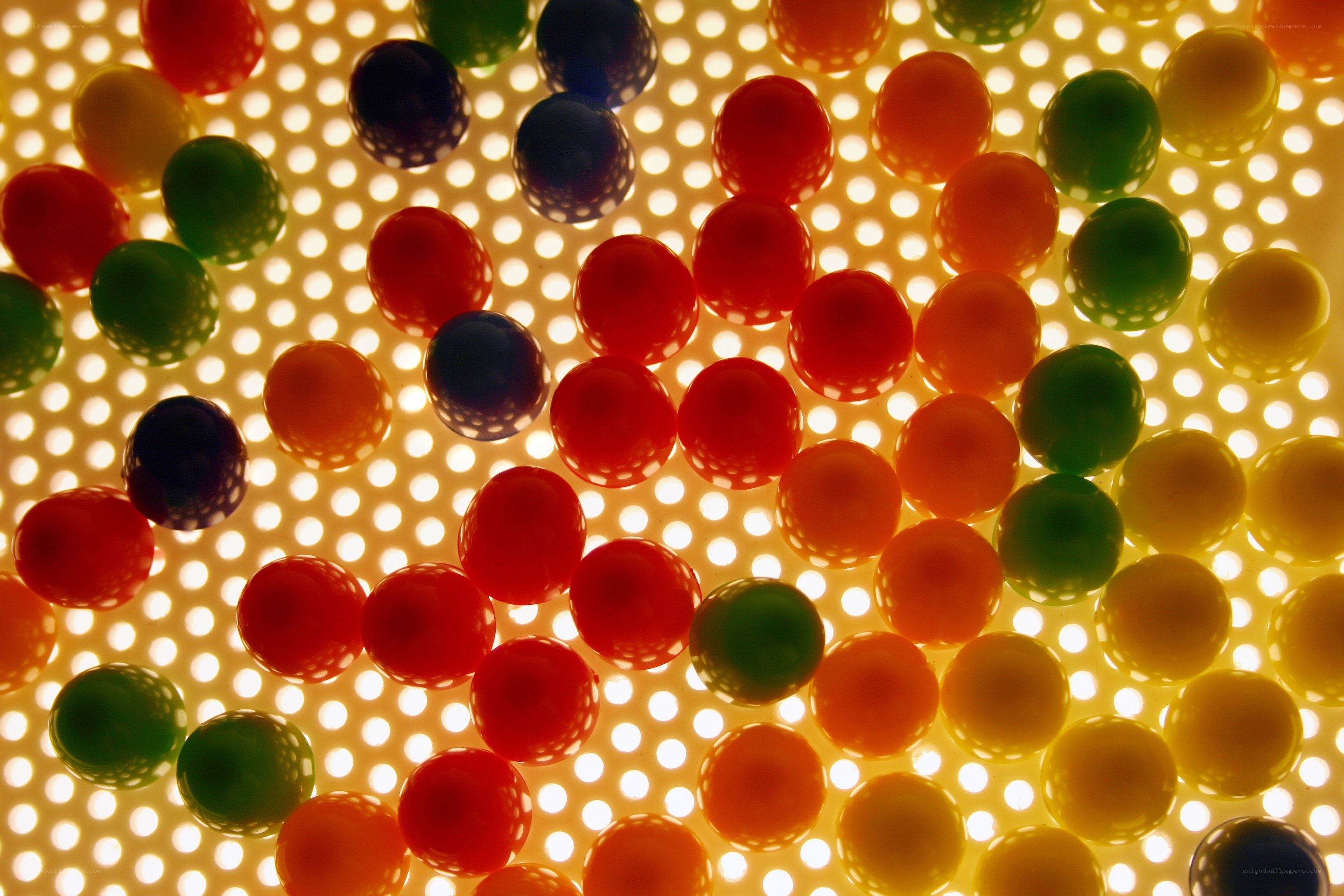 Colorful balls on perforated surface