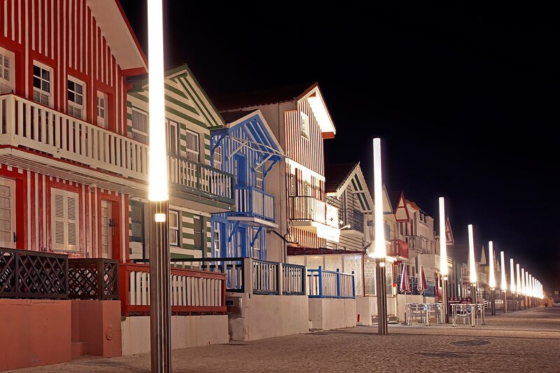 Colorful beach houses at night