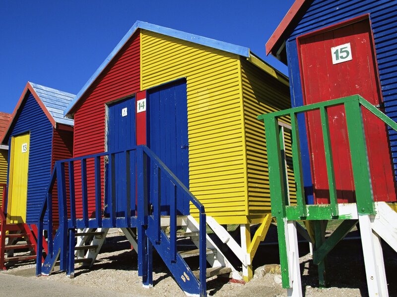 Colorful beach huts on a sunny day