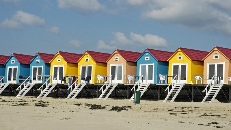 Colorful beach huts on a sunny day