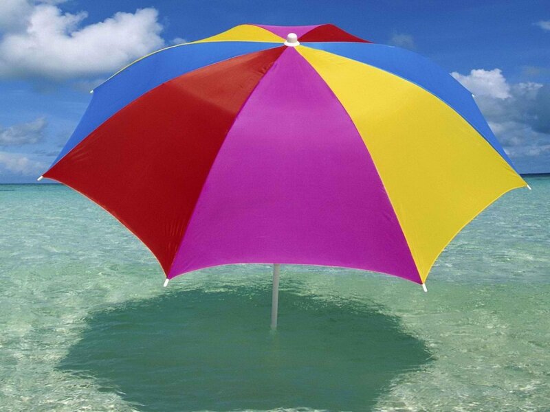 Colorful beach umbrella in ocean
