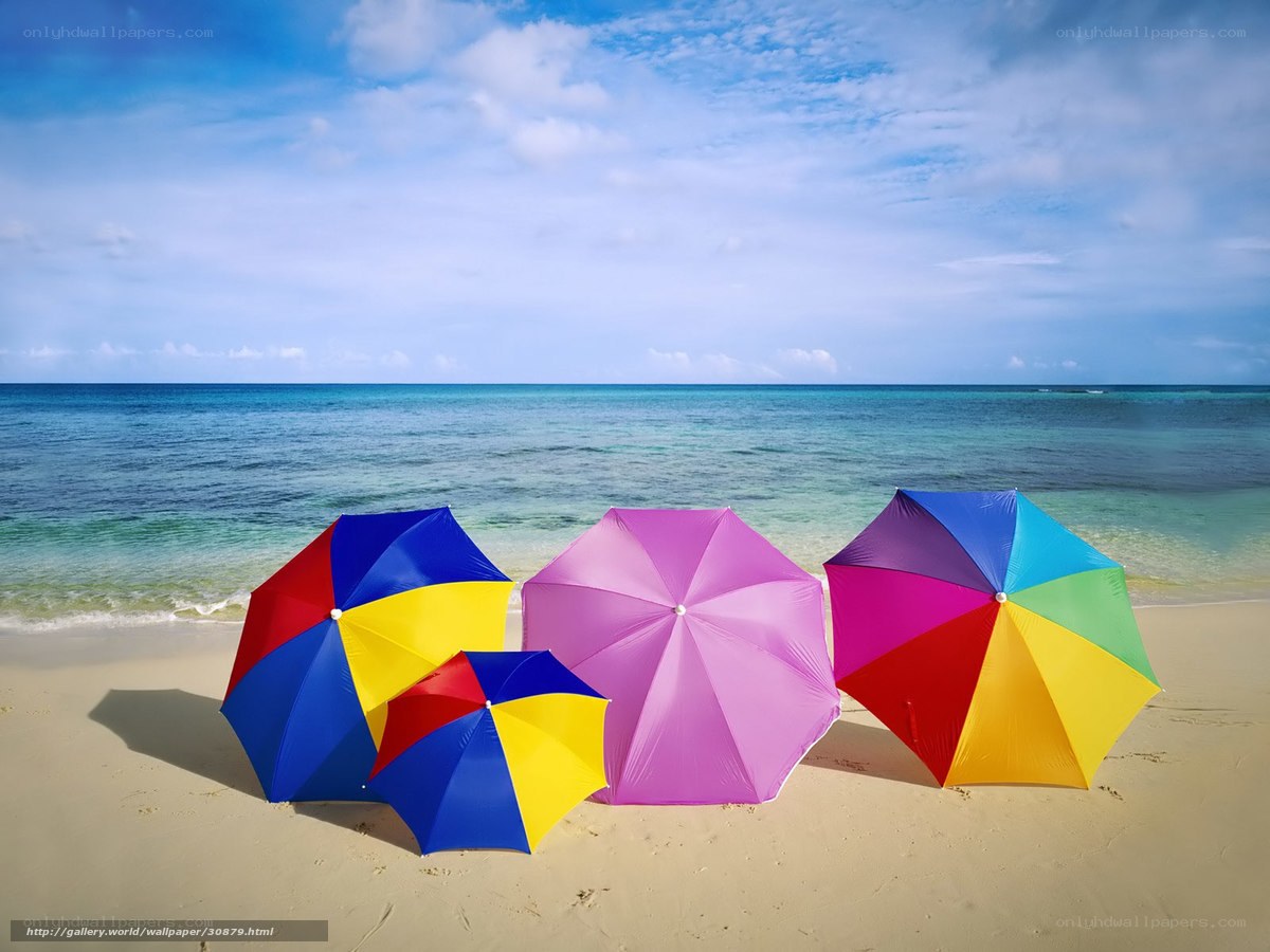 Colorful beach umbrellas on sand