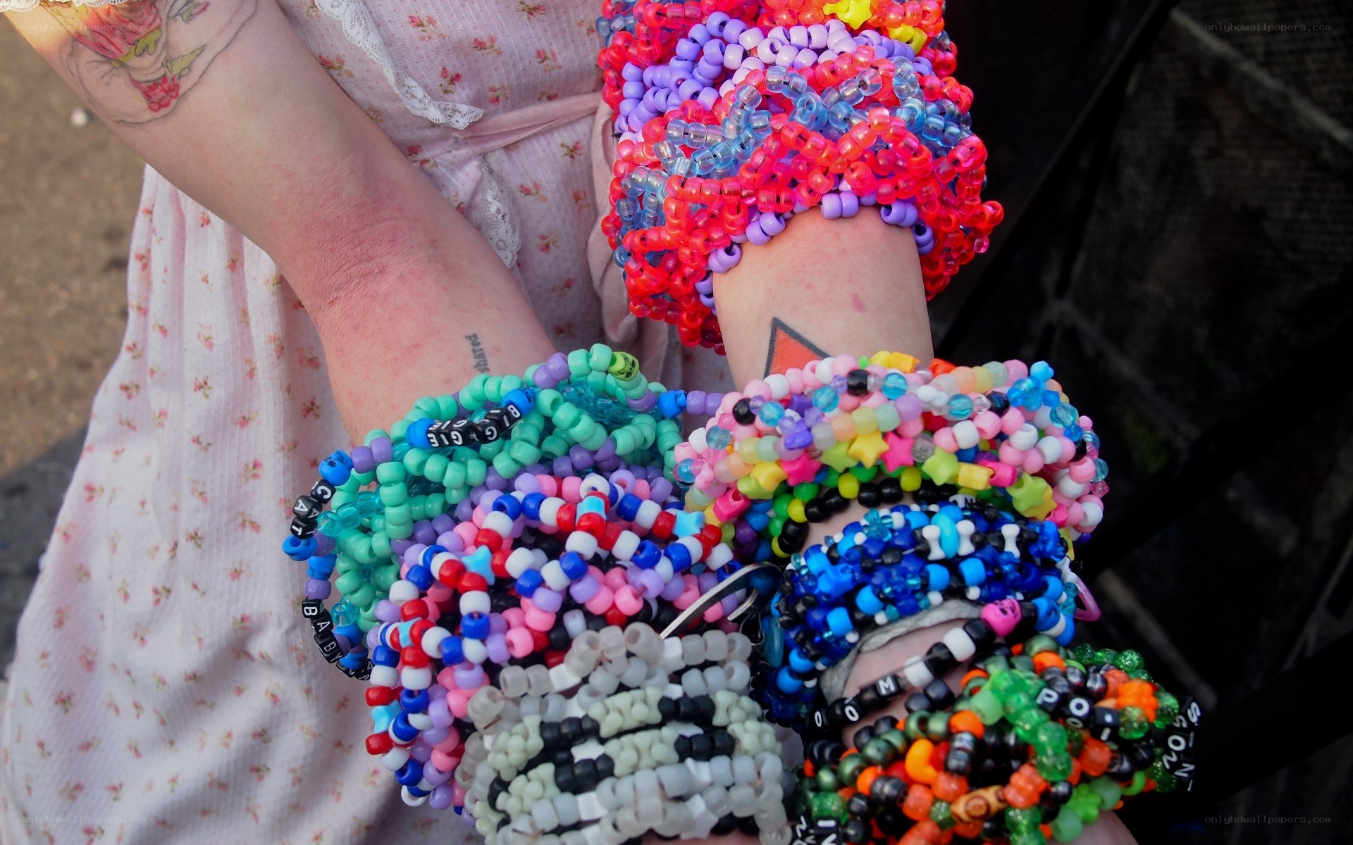 colorful beaded bracelets on arms