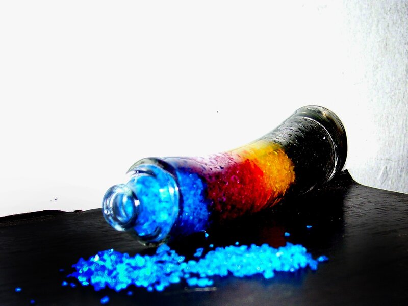 Colorful beads in a glass bottle