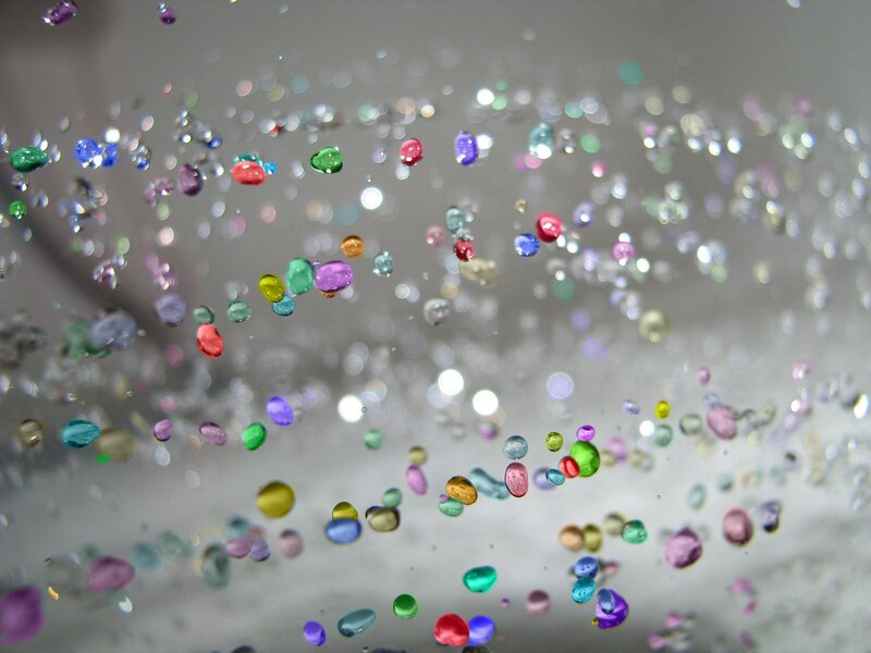 Colorful beads in water