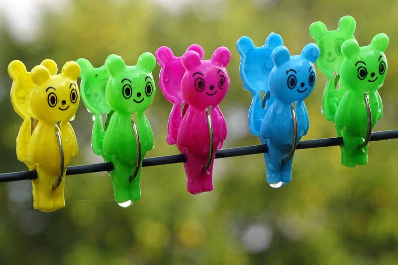 Colorful bear clothespins on a line