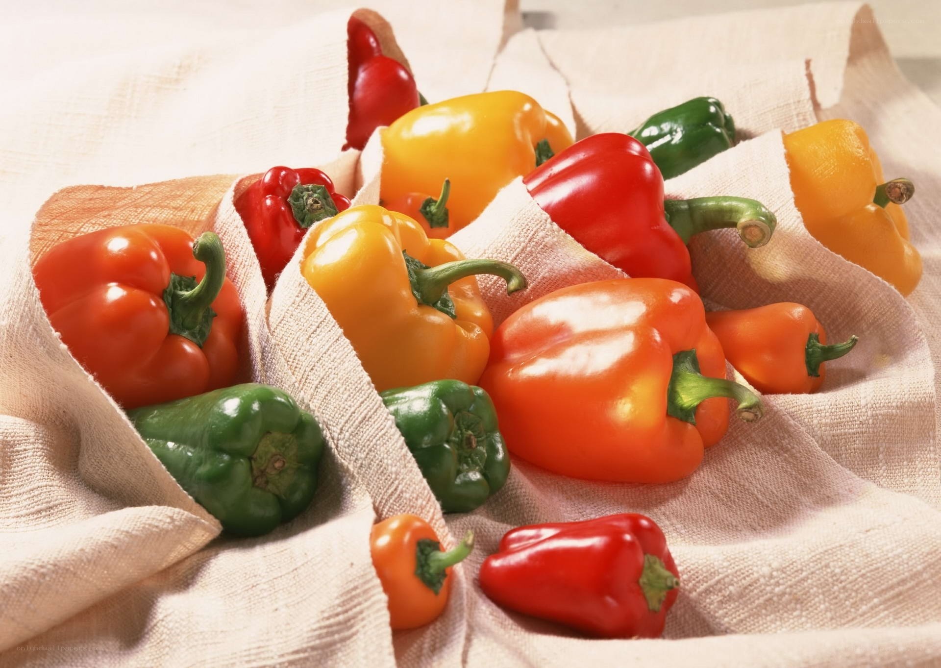 Colorful bell peppers on cloth