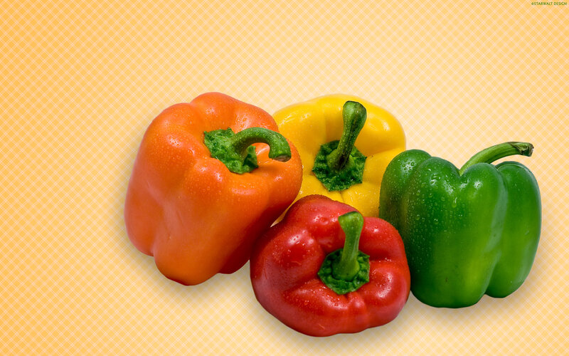 Colorful bell peppers on patterned background