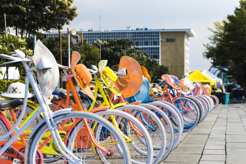 Colorful Bicycles in Row — White