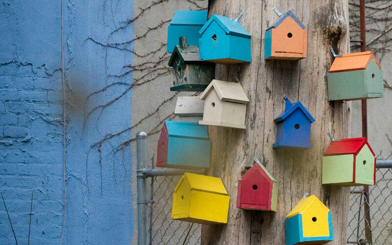 Colorful Birdhouses on Pole