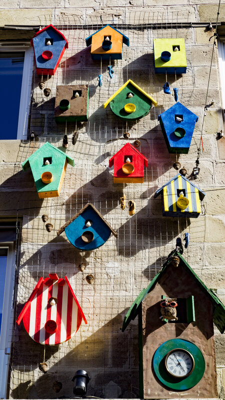 Colorful Birdhouses on Wall
