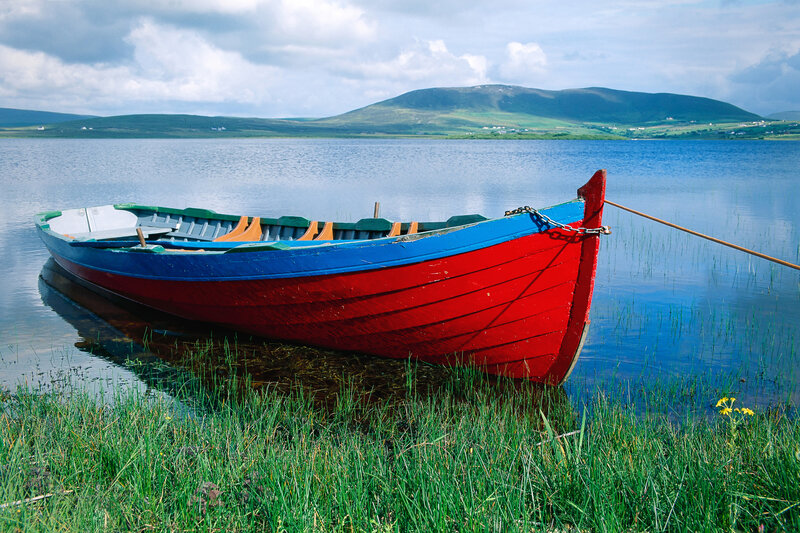 Colorful boat on a calm lake
