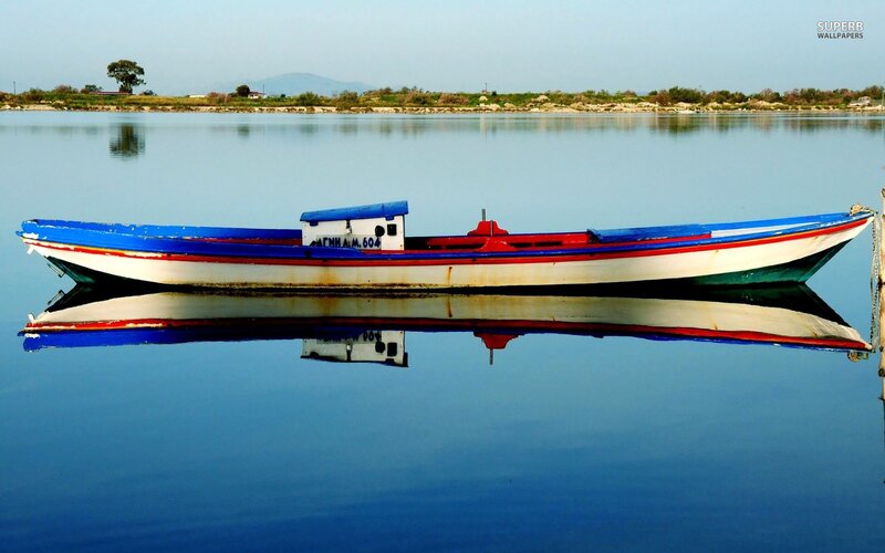 Colorful boat on calm water