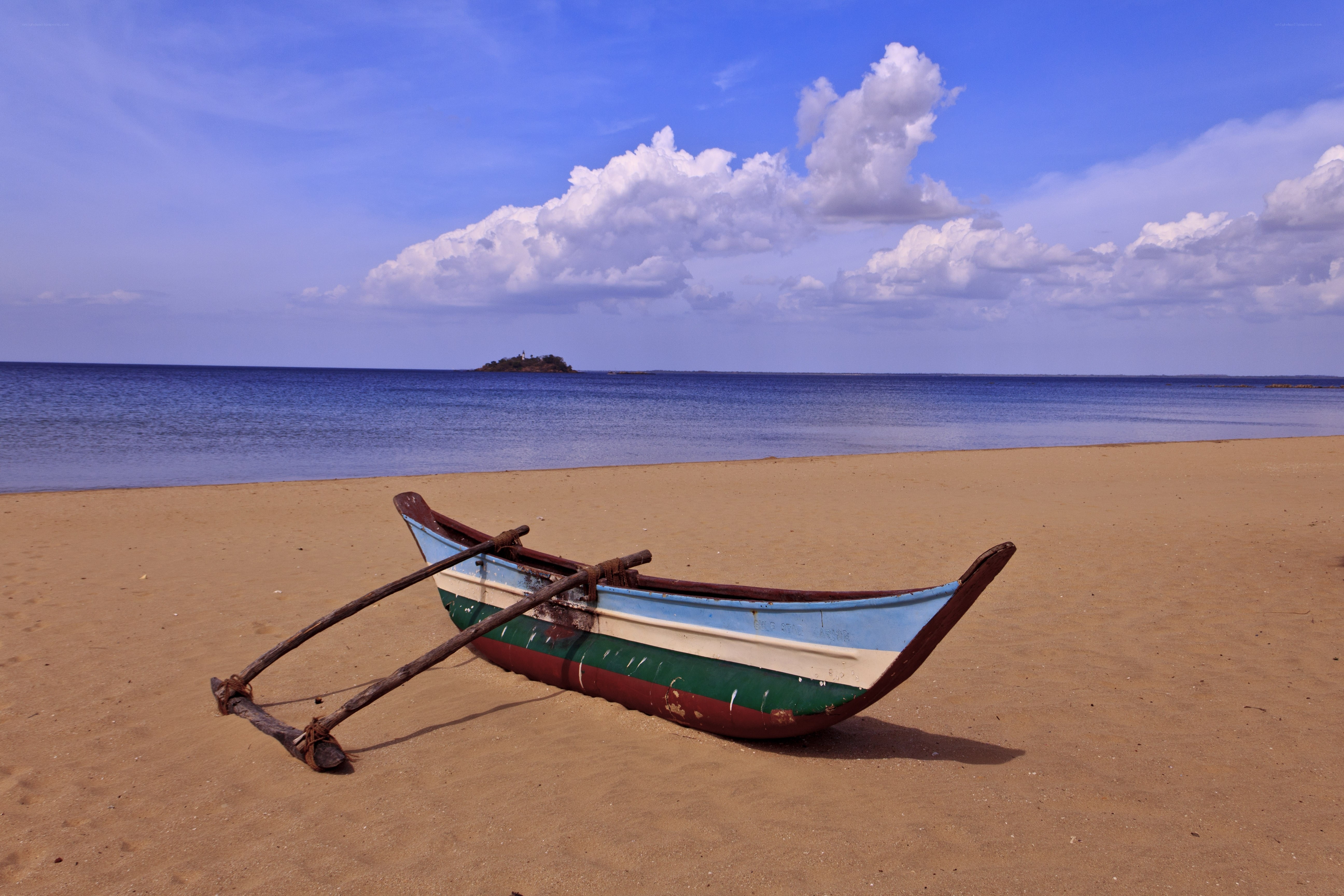 Colorful boat on sandy beach