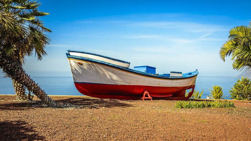 Colorful Boat on Shore — Blue