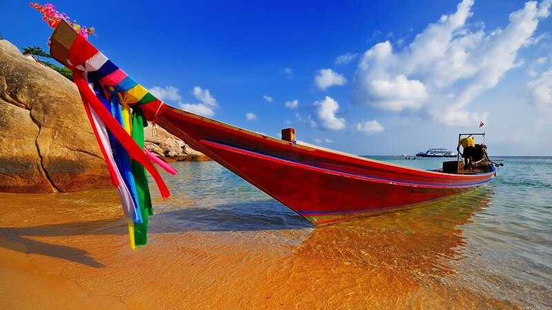 Colorful boat on tropical beach