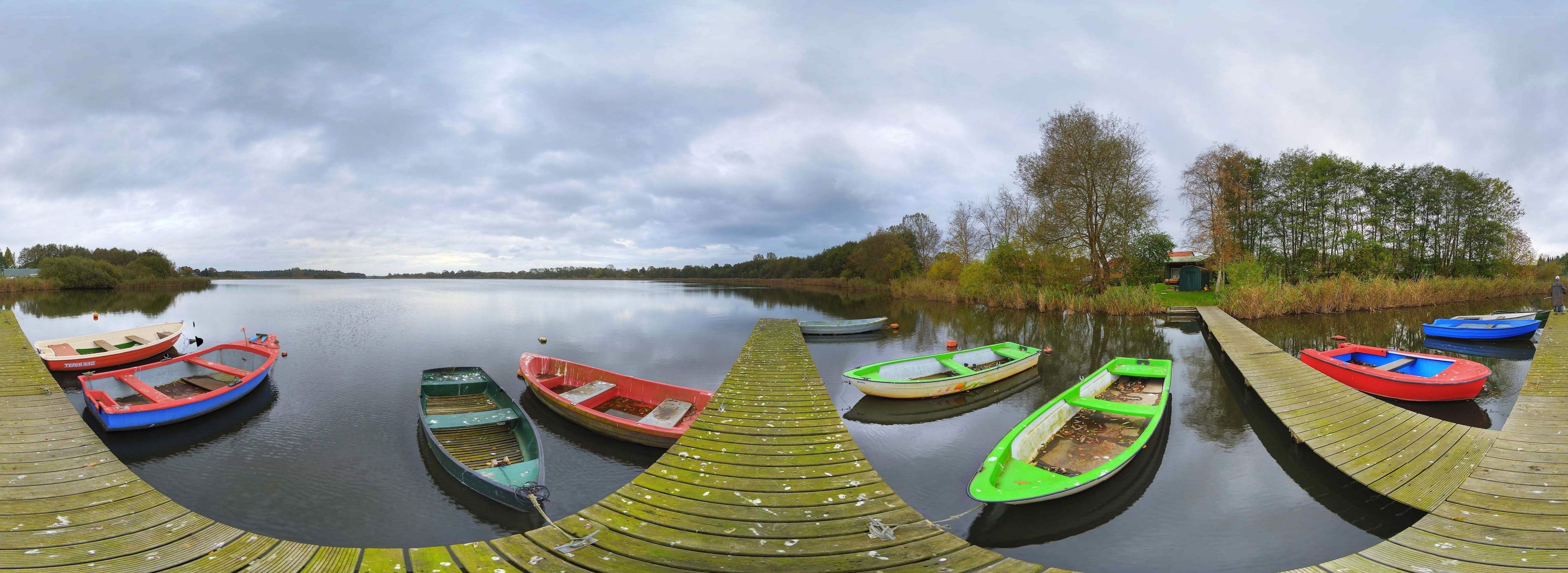 Colorful boats at a lakeside dock