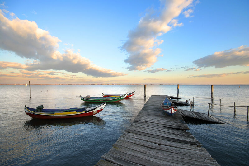 Colorful boats at a wooden dock