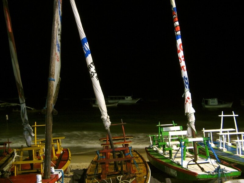 Colorful boats at night on a beach
