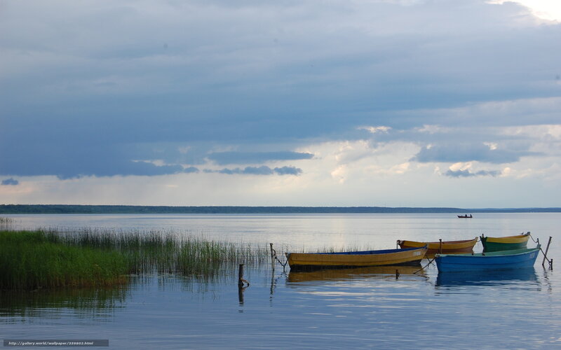 Colorful boats on a calm lake