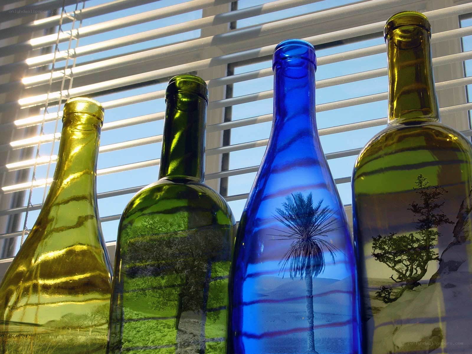 Colorful bottles with landscape reflections