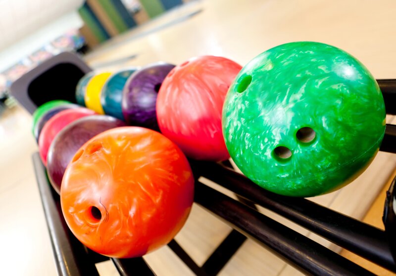 Colorful bowling balls in a rack