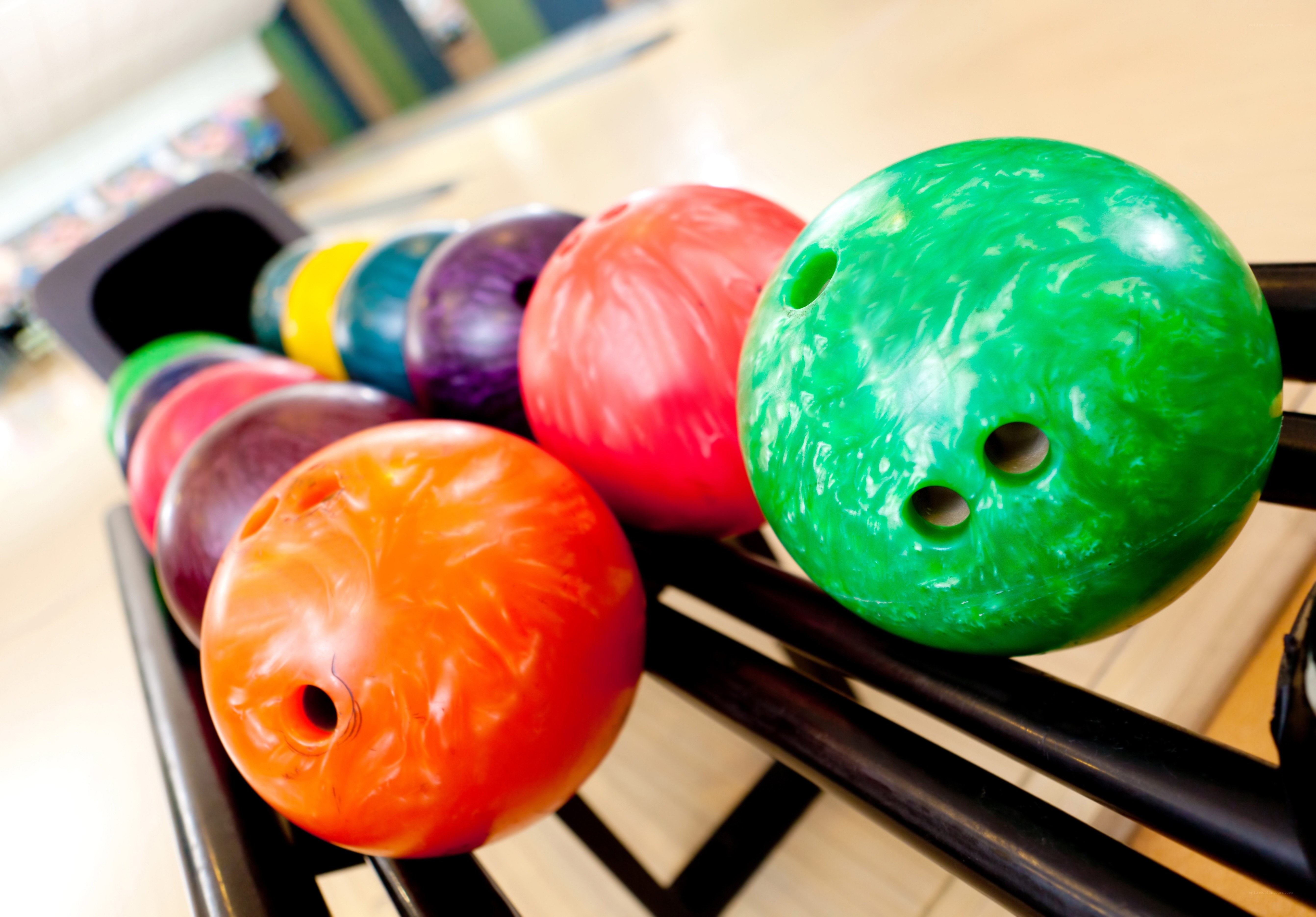 Colorful bowling balls in a rack