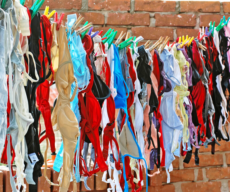 Colorful bras hanging on a line