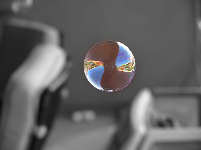Colorful bubble in grayscale room
