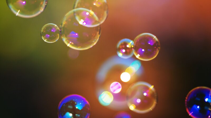 Colorful bubbles floating in light