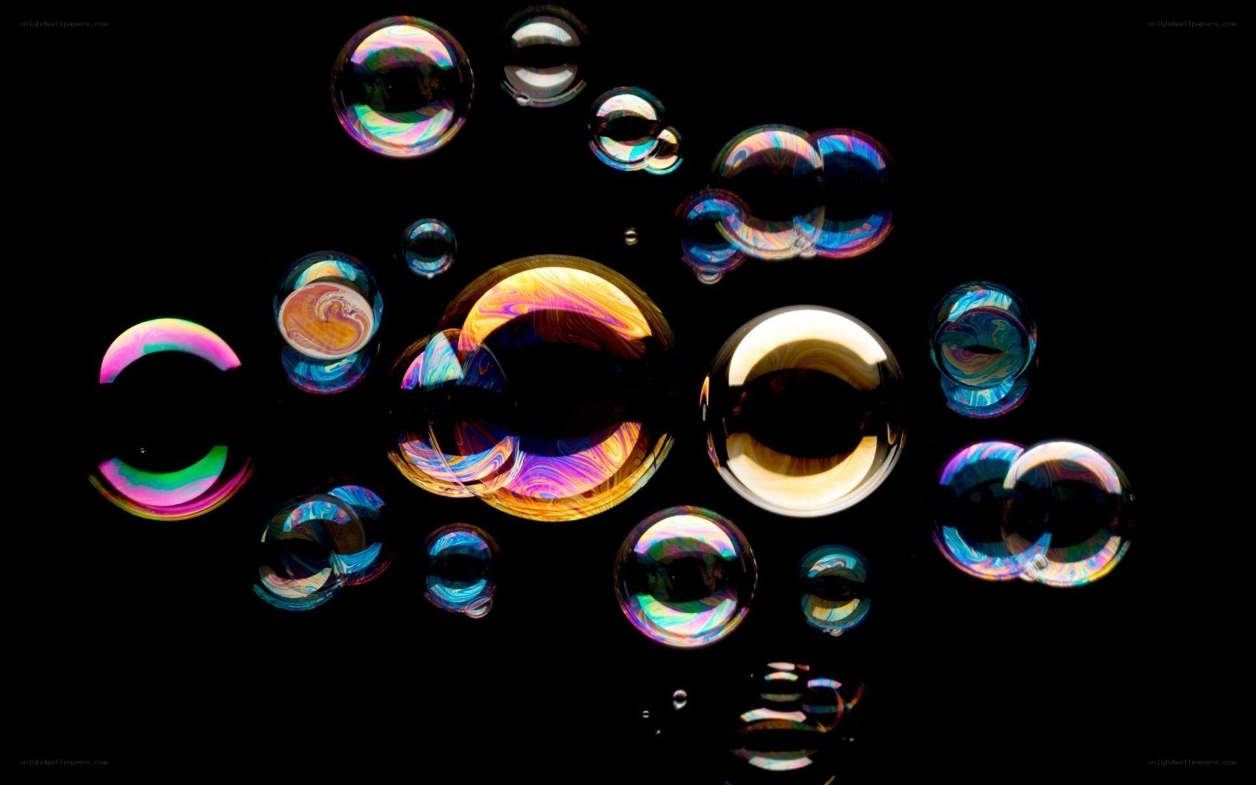 Colorful bubbles on black background