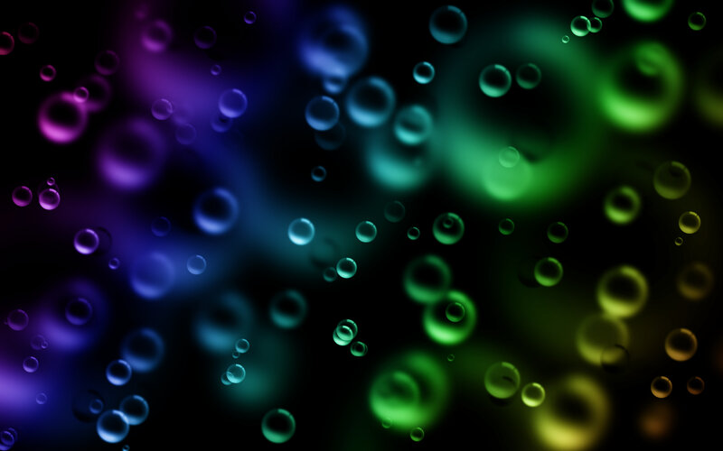 Colorful bubbles on dark background