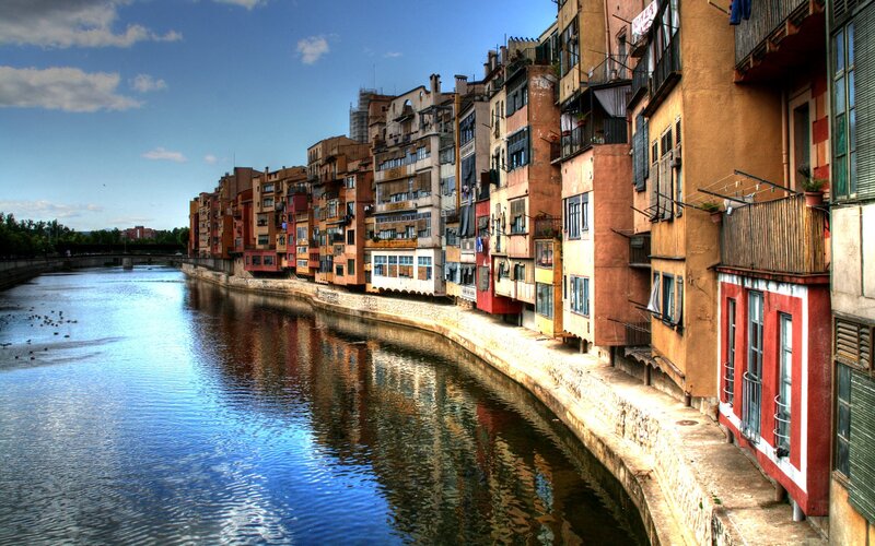Colorful Buildings Along River — Blue, Serene, Afternoon, Photograph