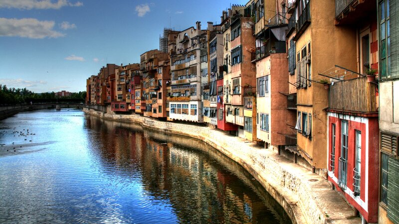 Colorful Buildings Along River — Blue