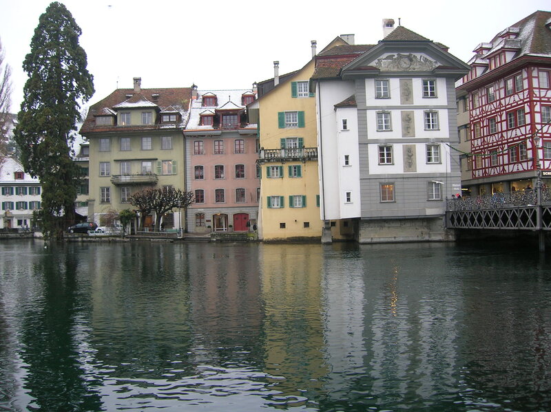 Colorful Buildings Along River — Green