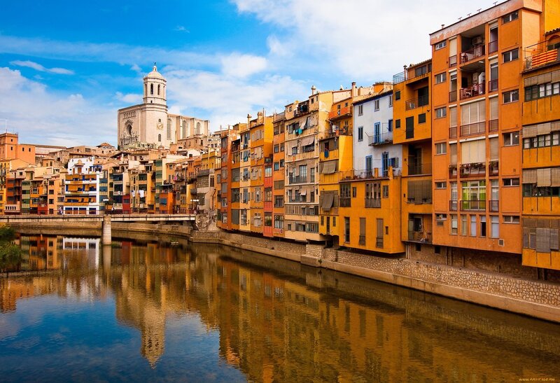 Colorful Buildings Along River — Orange, Serene