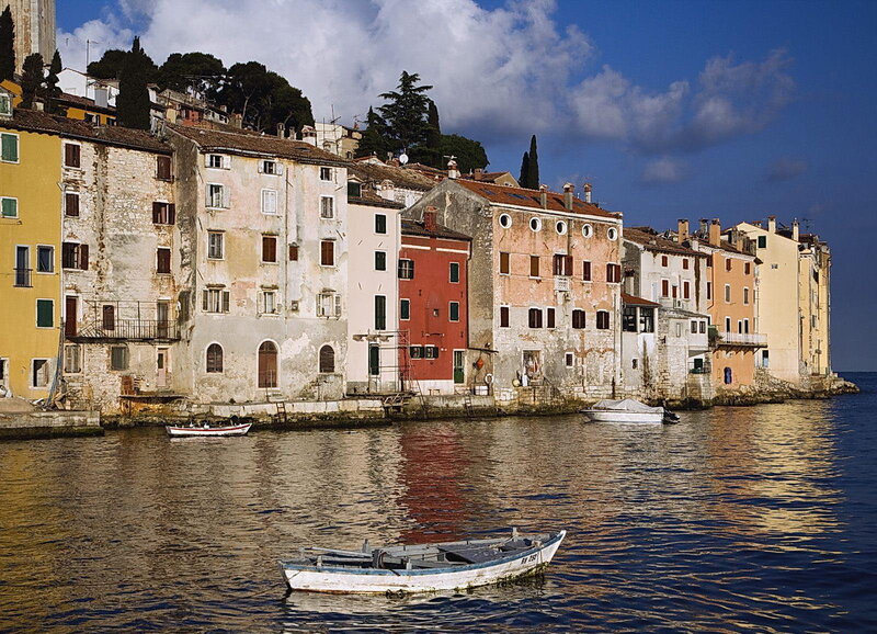 Colorful Buildings by Water — Blue, Serene, Afternoon