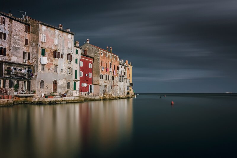 Colorful Buildings by Water — Red