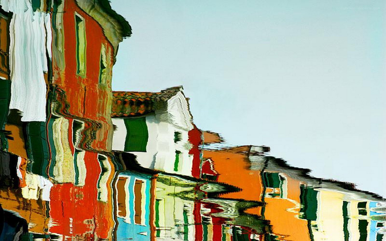 Colorful buildings reflected in water